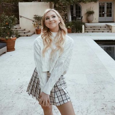 Picture of  Lilia Buckingham by wearing skirt.